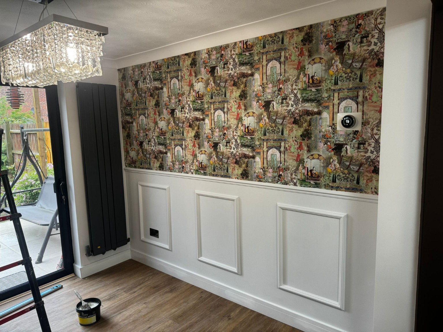 Completed decorative wall panelling and wallpaper